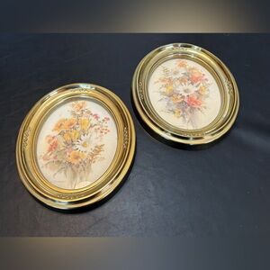 Syroco pair of vintage-style oval floral pictures in gilded frames.